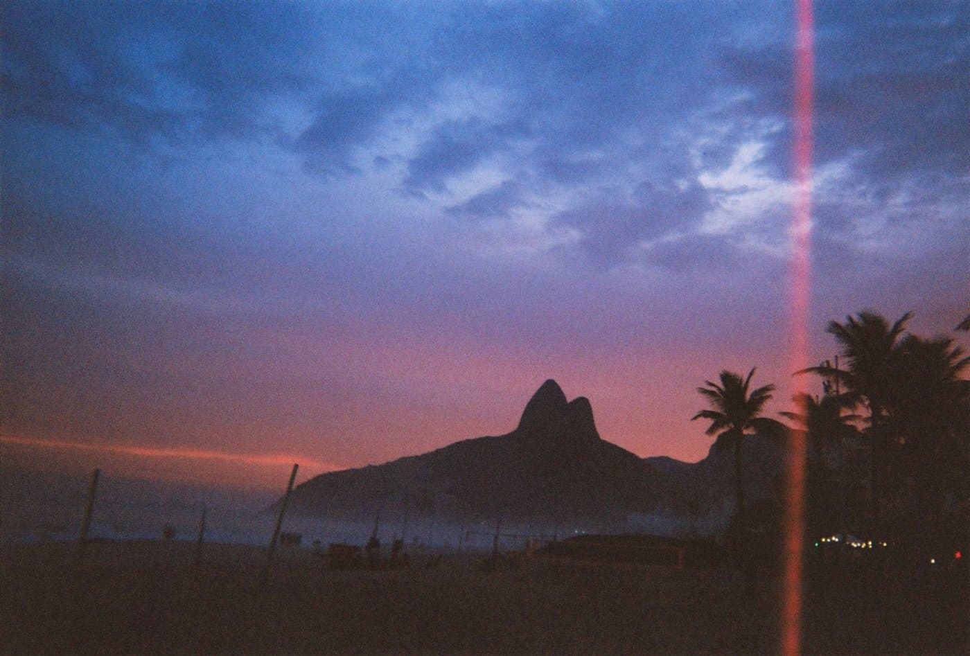 Sunset over the Two Brothers mountain at Ipanema beach